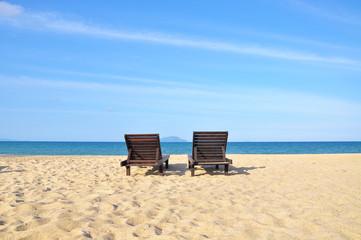 Beach chairs on sand beach. with copy space area