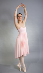 Fototapeta na wymiar Ballerina In Pink Dress