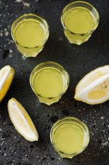 Italian traditional liqueur limoncello with lemon