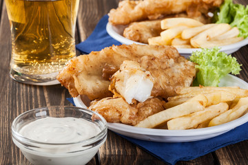 Fish and chips with tartar sauce on a plate