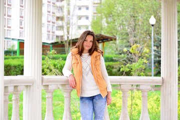 pretty young woman in a gazebo at the park