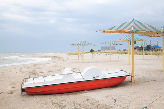 Lone catamaran on a deserted beach