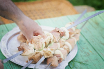 kebab skewers put on the meat on a skewer