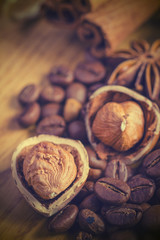 Anise stars peanuts roasted coffee beans and cinnamon on wooden
