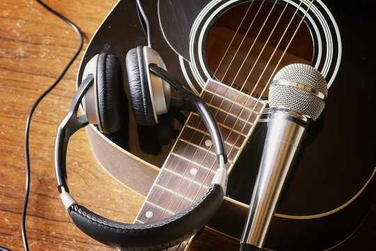 instrument guitar headphones and microphone