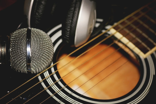 instrument guitar headphones and microphone