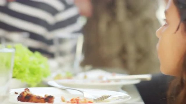 A girl observing at a Brazilian family BBQ