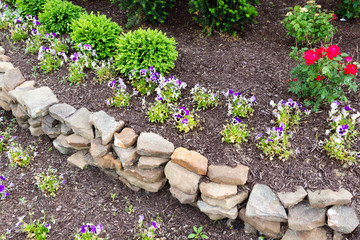 Natural rock retaining wall in a garden