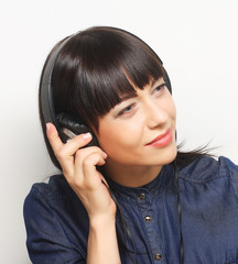  woman with headphones listening to music