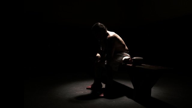 Athlete does jump ropes for strength training. Wide shot.