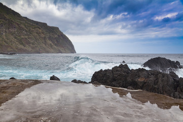 Rocky shore and natural pool. Porto Moniz, Madeira island, Portugal
