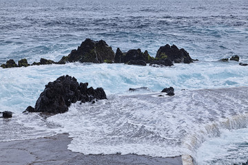 Rocky shore and natural pool. Porto Moniz, Madeira island, Portugal