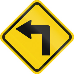 Colombian road warning sign: Left curve ahead
