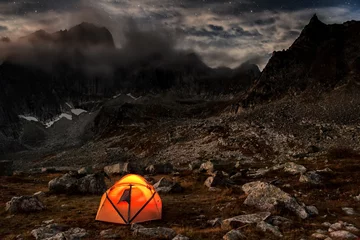 Tuinposter Camping at night in the mountains © tolstnev