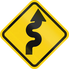 Colombian road warning sign: Winding road, right version