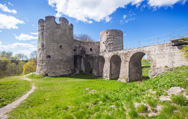 Fototapeta na wymiar Medieval Russian Koporye fortress with two towers and bridge