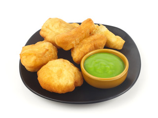 Dish of deep-fried doughstick on white background