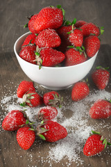 Strawberries in bowl with sugar