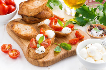 bruschetta with mozzarella, basil and cherry tomatoes
