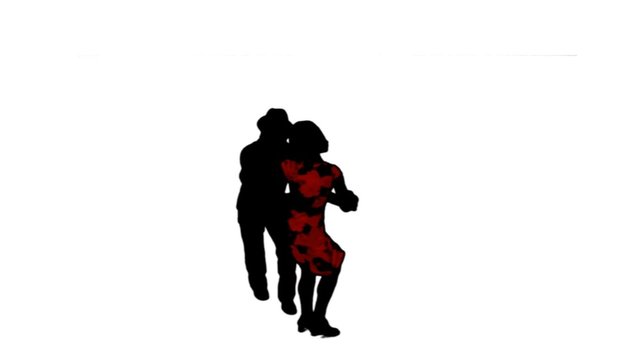 A salsa dancing couple silhouetted on blue dance energetically