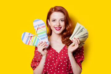 girl in red dress with flip flops and money