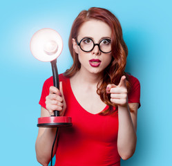  girl in red dress with lamp