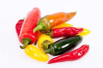 heap of colorful raw chili pepper isolated on white background