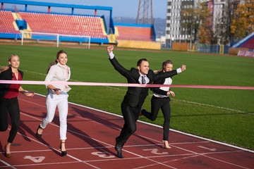 business people running on racing track