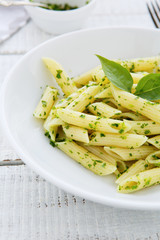 penne pasta in a white bowl