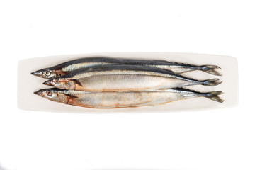 Fresh Japanese Sanma fish on plate