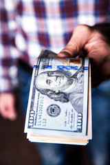 dollars in the hands