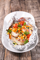 fish and vegetable cooked in paper