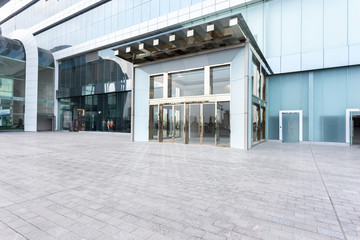 Empty road and building facade