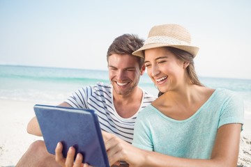 happy couple using tablet computer 