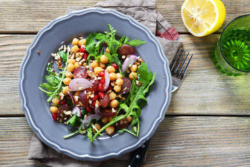 Salad with chickpeas, arugula with grapes
