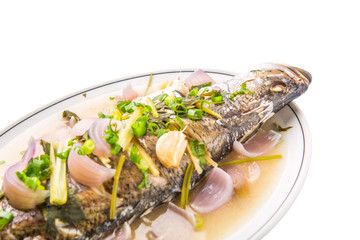 Malaysian dish of sweet and sour steamed Asian bass fish