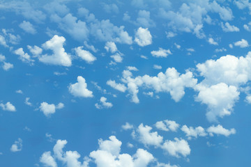 Blue sky background with tiny clouds