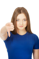 Young woman with thumbs down.