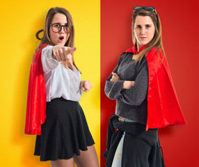 Twin sisters dressed like superhero