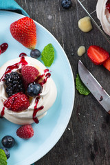 Homemade pavlova meringue with summer fresh berries