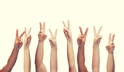 human hands showing v-sign