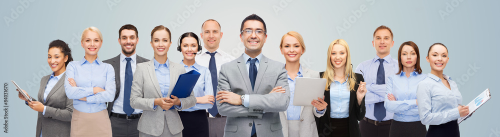 Canvas Prints group of happy businesspeople over blue background