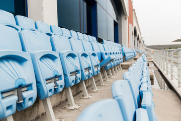 Fototapeta premium rows with folded seats of bleachers on stadium