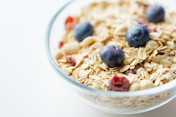 close up of bowl with granola or muesli on table