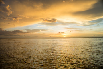 sunset on the sea with cloudy sky background