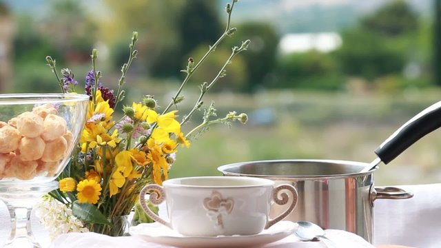 slow food - woman pours soup