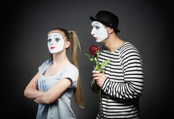 Male mime giving a flower to female mime