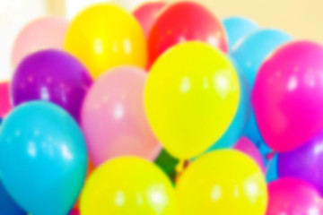 Fototapeta na wymiar Group of colorful balloons, blurred photo