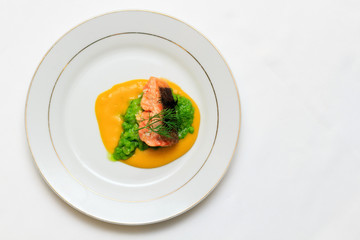 Mountain trout "Orientale", stewed in orange sauce, top view
