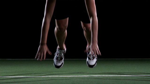 Close up of a female athlete jumping up and down into the push up position 